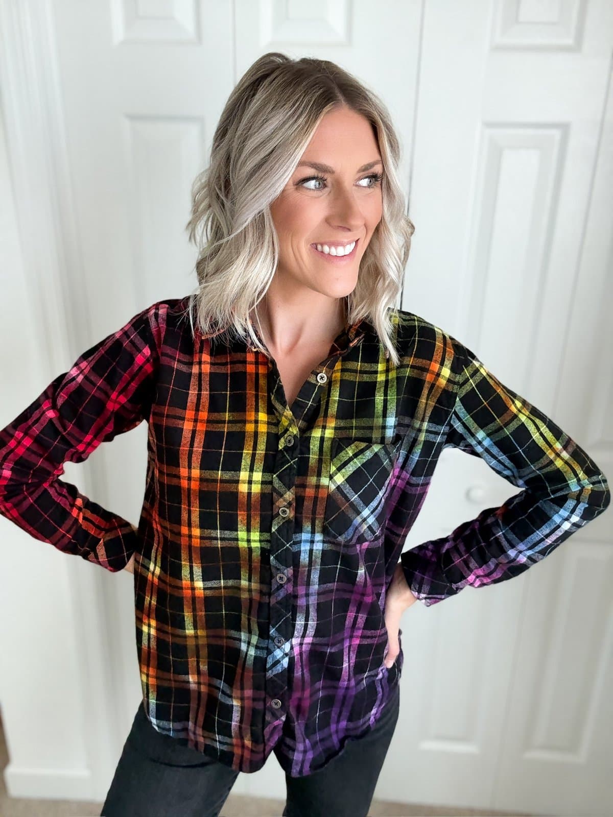 Maria wearing rainbow ice-dyed plaid flannel shirt